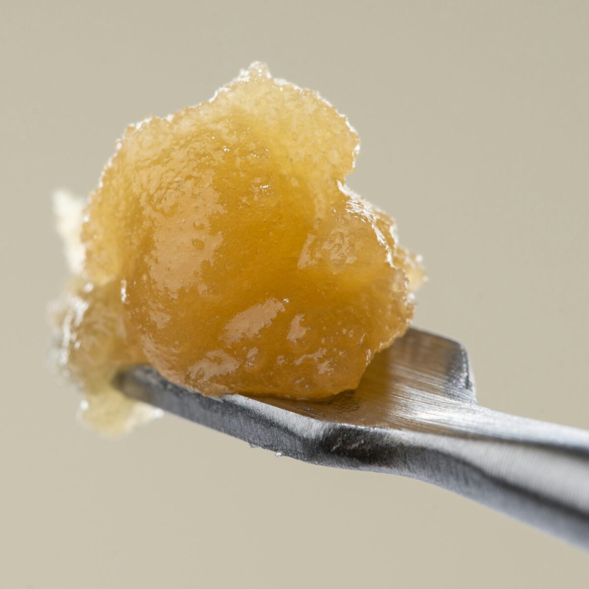 image of cannabis dab tool holding a dab of cannabis concentrate