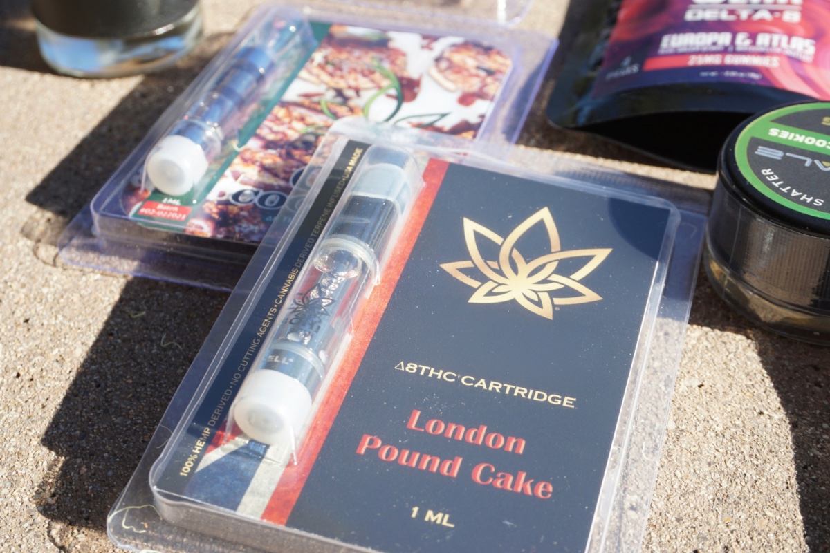 A packaged 1ML Delta 8 THC vape cartridge with "London Pound Cake" strain name, typical of the products sold by unlicensed retailers and used as an example of questionable dispensary inventory.