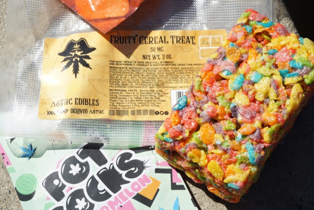 Fruity Cereal Treat 50 MG edible packaging next to the colorful cereal bar, highlighting the appealing edibles often found in unlicensed or fake dispensaries that lack required testing and legal labeling.