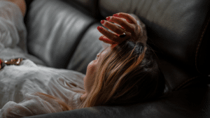 woman laying on couch