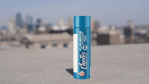 picture of a Jeeter High Tide 2g quad infused preroll sitting on a wall against the Kansas City skyline, sold at NatureMed